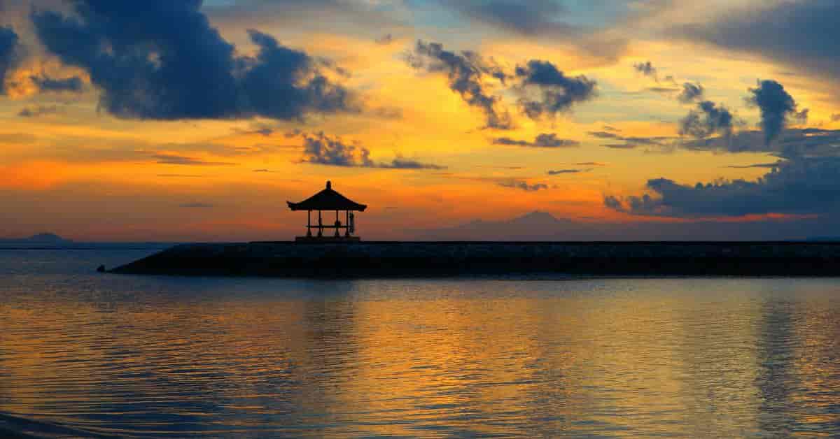scenic-aerial-shot-of-sanur-beach-highlighting-the-sandy-shoreline-and-an-elegant-resort-overlooking-the-ocean.